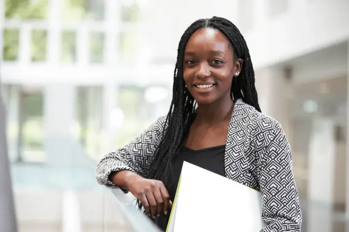 black woman holding folder